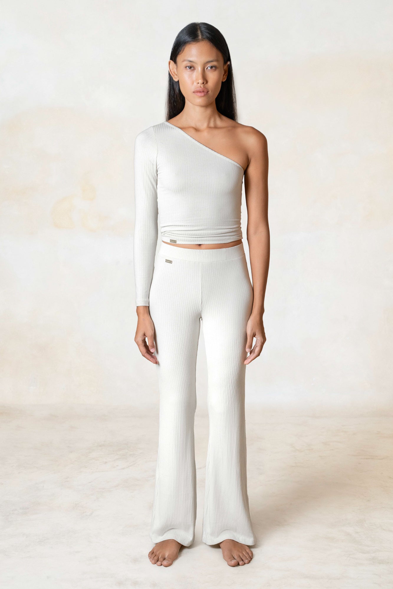 Studio K Rib One Shoulder Top in Ivory – sustainable, stylish, and comfortable yoga and lounge wear, available in multiple sizes.
